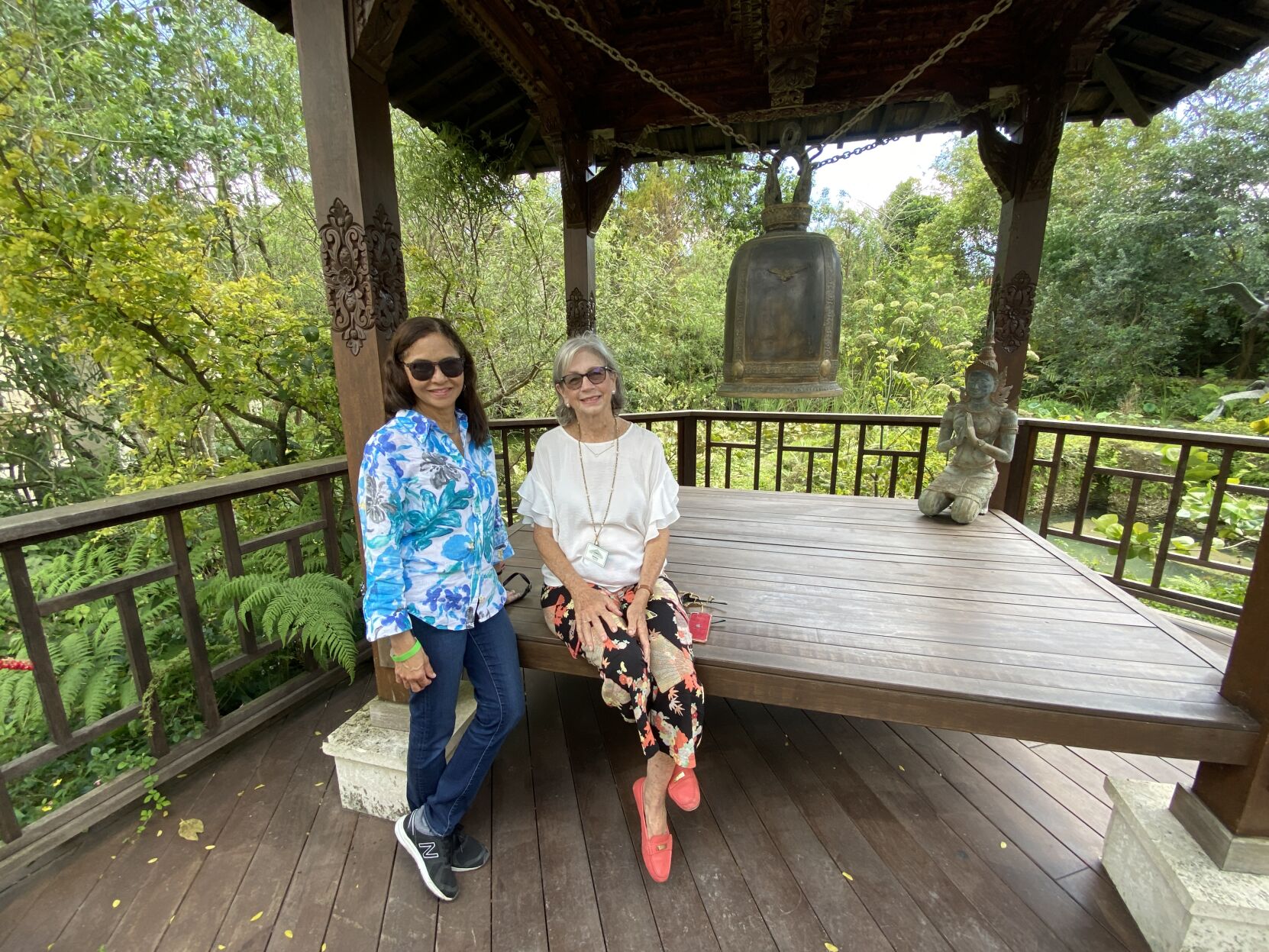 Right: The Tea House provided a nice resting spot for Yiris Castro and Villager Kitty Terry, at the Patch of Heaven Sanctuary.